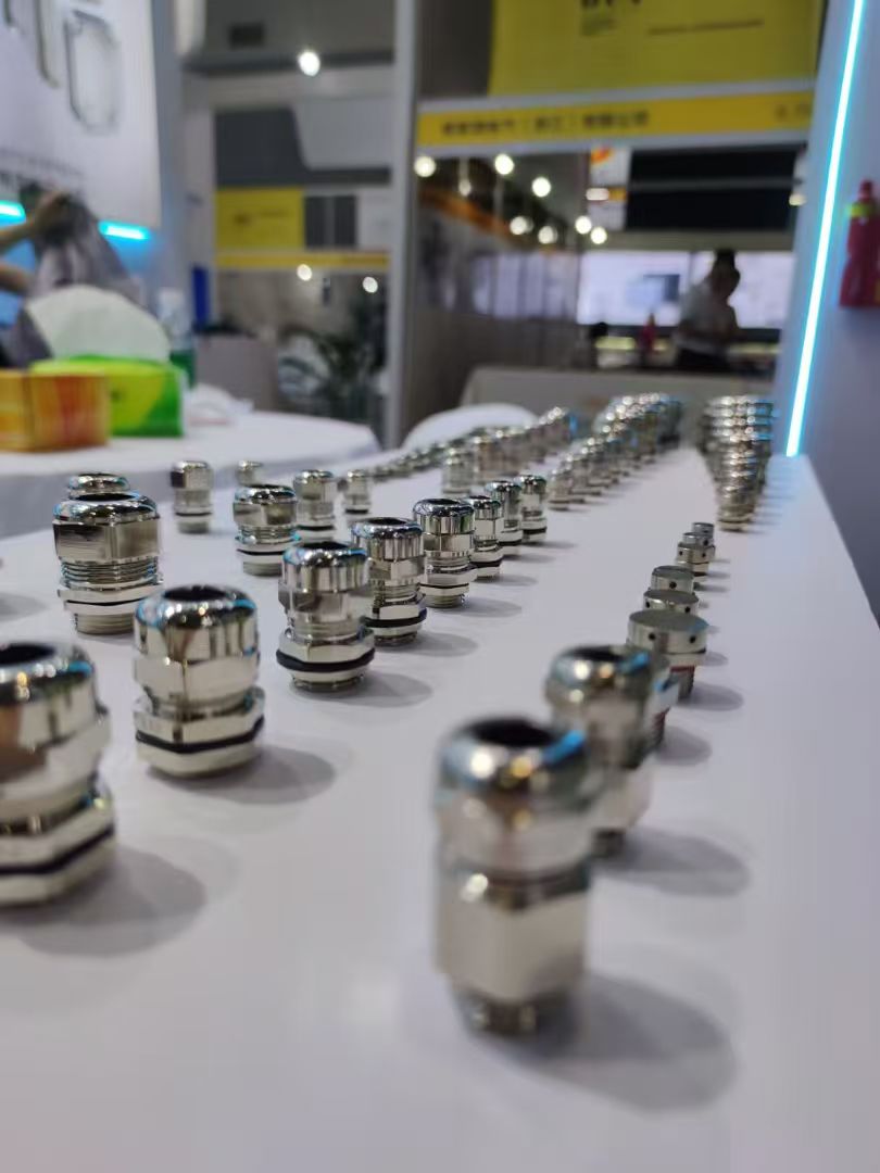Nickel-plated metal cable glands on display